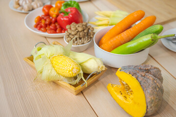 Fresh vegetable and fruit on wooden table in kitchen