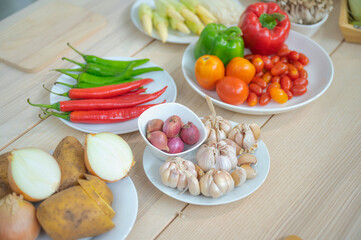 Fresh vegetable and fruit on wooden table in kitchen