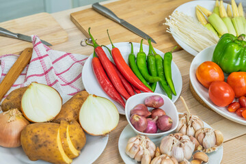 Fresh vegetable and fruit on wooden table in kitchen