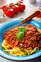 Delicious spaghetti bolognese on white background