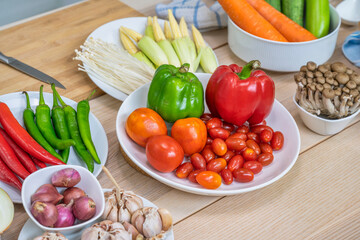 Fresh vegetable and fruit on wooden table in kitchen