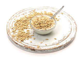 oatmeal in a glass bowl on a wooden substrate