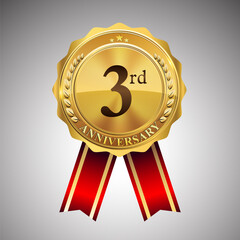 Celebrating 3rd anniversary logo, with golden badge and red ribbon isolated on white background.