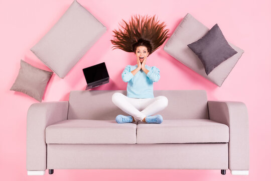 Top view above high angle flat lay flatlay lie concept of her she nice attractive lovely amazed cheerful glad girl sitting on divan spending time leisure isolated over pink pastel color background