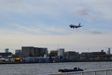 Fototapeta na wymiar airplane comming to landing at City airport, London, England, Great Britain (United Kingdom - UK)