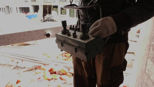 Man controls remote control at construction site