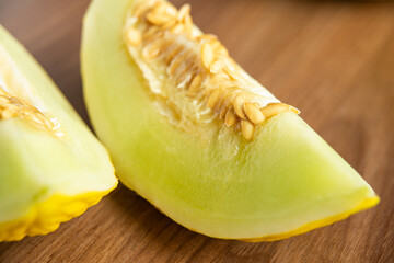Yellow melon on a wooden table