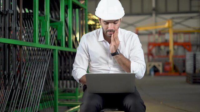 The engineer examined the computer with a bad mood