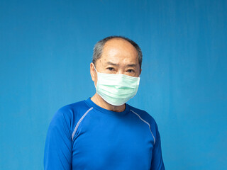 An asian middle age hoary senior man wearing a mask to protect coronavirus