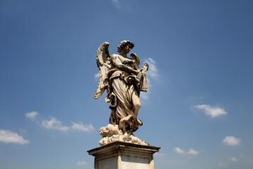 Fototapeta na wymiar Rome's Angel statue with sky background at St. Angelo bridge Rome