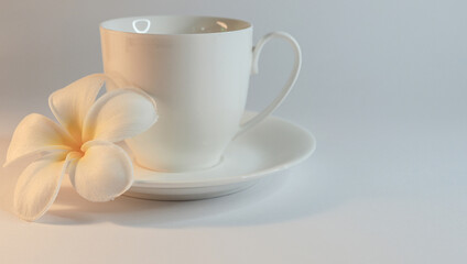 Fototapeta na wymiar coffee cup with lelawadee flower