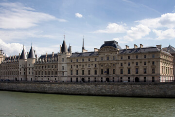 Historical building and Seine river with cloudy sky in summer in Paris