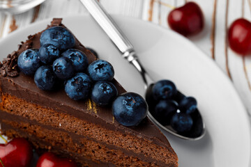 Piece of chocolate cake served with fresh berries