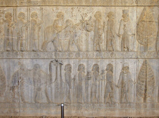Reliefs depicting the Persian courtiers & guardians leading guests to their king. Guests & their...