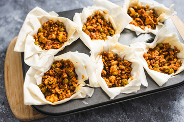 plant-based food, vegan filo pastries with spicy tofu and peas filling