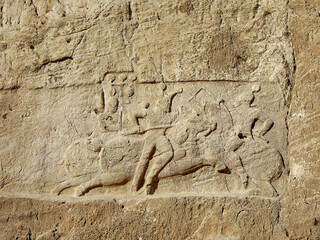 Bas-relief in Naqsh-e Rostam, depicting Sassanian king Bahram II battling a mounted Roman enemy. Naqsh-e Rostam located near Persepolis, Iran, and famous for its 4 rock tombs of ancient Persian kings