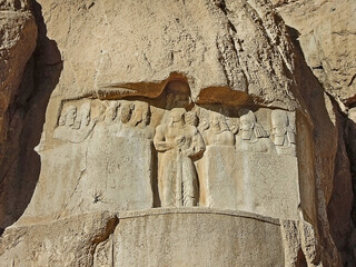 Bas-relief from Naqsh-e Rostam (near Persepolis, Iran) depicting Sassanian king Bahram II among...