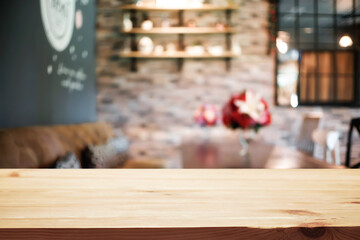 Empty wooden table space platform and blurred restaurant or coffee shop background for product display montage.
