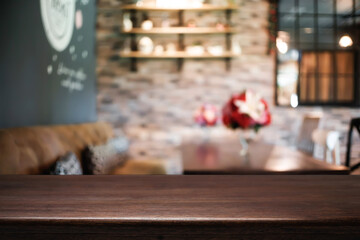 Empty wooden table space platform and blurred restaurant or coffee shop background for product display montage.