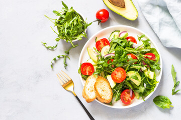 Green salad from leaves and vegetables.