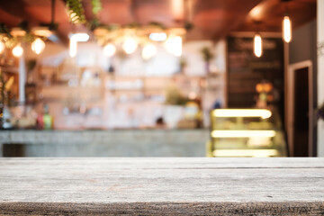 Empty wooden table space platform and blurred resturant or coffee shop background for product display montage.
