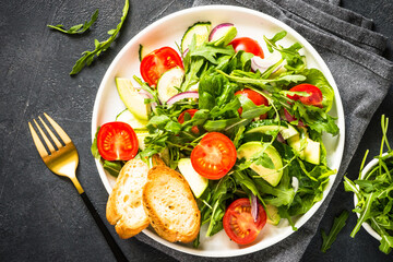 Green salad from leaves and vegetables.