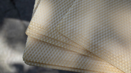 yellow beecomb with empty cells for honey with hexagon shapes, apiculture concept. High quality...