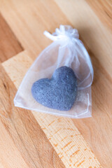 Handmade colorful soaps in white bag. Gift package.