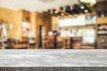 Empty wooden table space platform and blurred resturant or coffee shop background for product display montage.