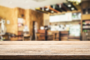 Empty wooden table space platform and blurred resturant or coffee shop background for product display montage.
