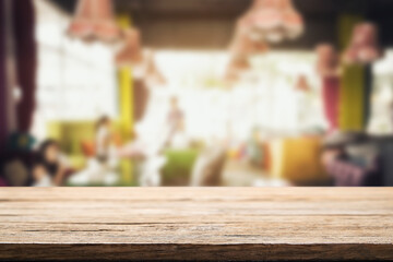 Empty wooden table space platform and blurred resturant or coffee shop background for product display montage.