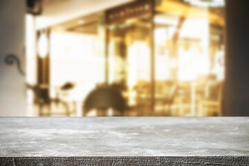 Empty wooden table space platform and blurred resturant or coffee shop background for product display montage.