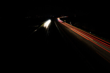 light trails on highway at night, long exposure photo