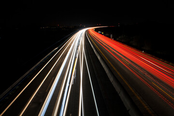 light trails on highway at night, long exposure photo