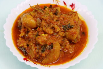 Dum aloo, potatoes in thick onion  tomato gravy 