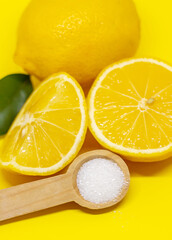 Citric acid on a yellow background. Selective focus.