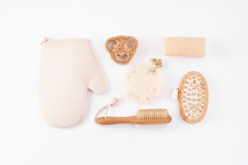 Zero waste cosmetics spa products on white. Set of ecofriendly bathroom accessories, tools for bath, brush, mitten, sponge. Plastic free. Beauty treatment and body care. Flat lay, top view.
