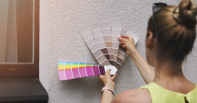 designer choosing paint color for house exterior stucco facade