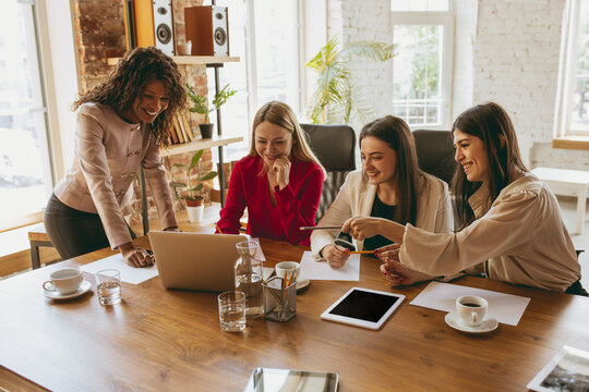 Young Caucasian Business Woman In Modern Office With Team. Creative Meeting, Tasks Giving. Women In Front-office Working. Concept Of Finance, Business, Girl Power, Inclusion, Diversity, Feminism.