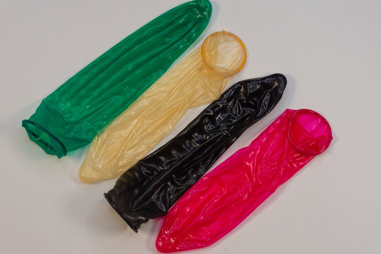 Display of colored condoms arranged neatly on a platform