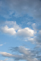 Natural sky composition. Sunny vast blue sky abstract background. Beautiful cloudscape, view over white fluffy clouds. Freedom concept, on the heaven. Element of design.
