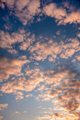 Naklejka na ściany i meble Natural sky composition. Sunset, sunrise dramatic sky abstract background. Beautiful cloudscape, view on a fluffy colorful clouds. Freedom concept, on the heaven. Twilight sunset nature landscape.
