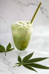 Green hemp drink latte on white background. Healthy fresh nutrition.