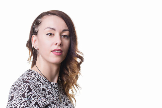 Portrait Of A Young Brunette Woman On A White Background. Twenty Five Year Old Girl.