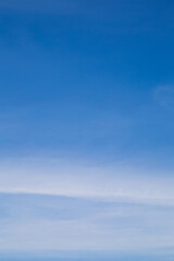 Vertical image white clouds in blue sky in clearly day.