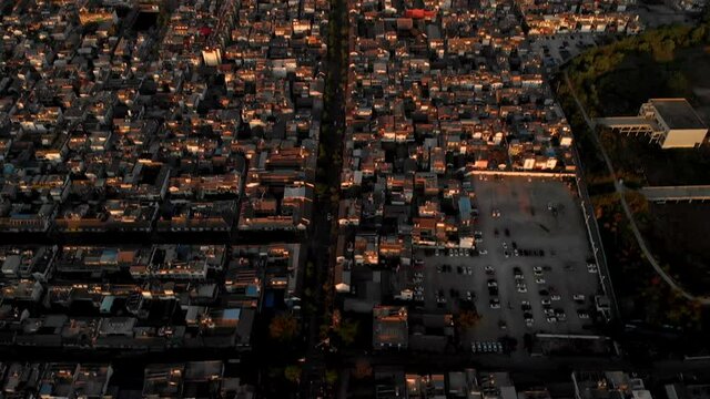 Dali City, China. Tilt Up Sunrise Aerial View of Cityscape Under Cangshan Mountain