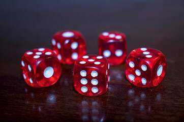 red dice on black background