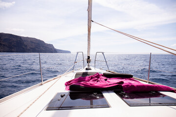 Obraz premium view from yacht at rock in Atlantic ocean and blue sky in Maspalomas, Gran Canaria