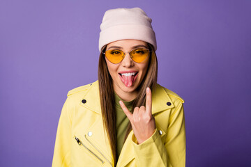 Close-up portrait of her she nice attractive cool lovely cheerful cheery girl punk showing horn sign grimacing isolated over bright vivid shine vibrant lilac purple violet color background
