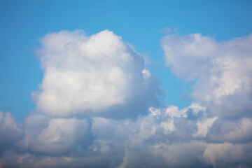 Background blue sky with white clouds. Cumulus clouds.